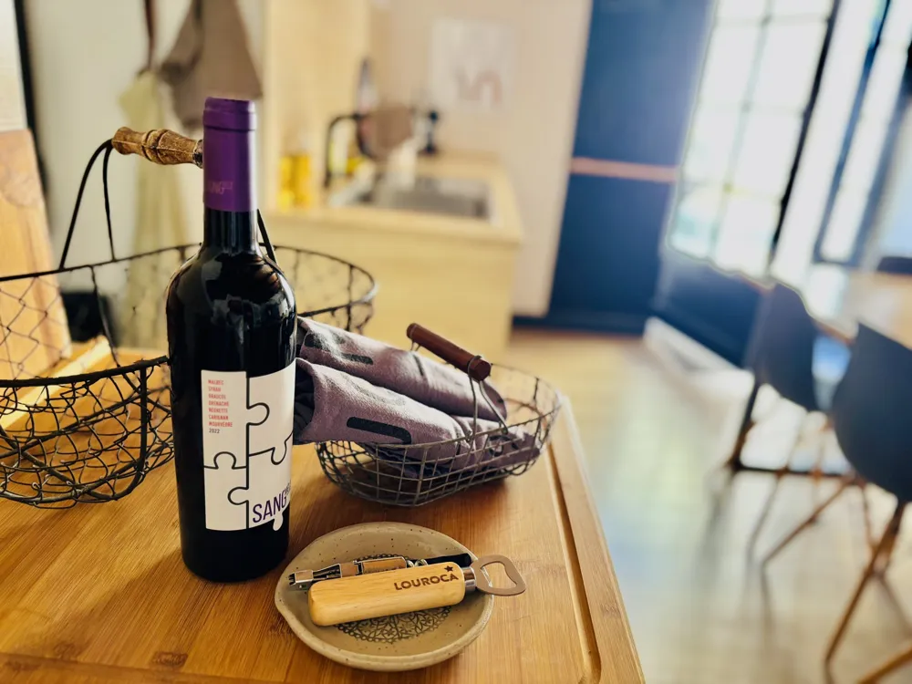 Wine bottle in a basket on the worktop