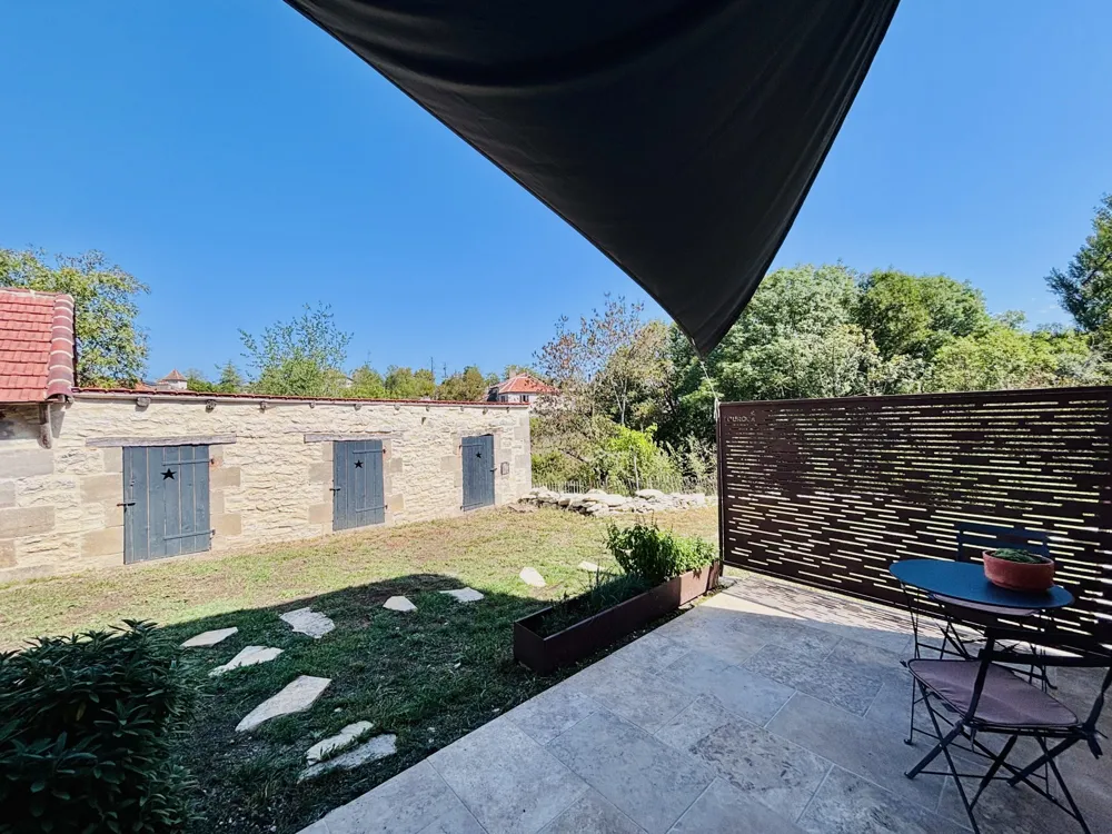 Summer kitchen terrace under a shade sail